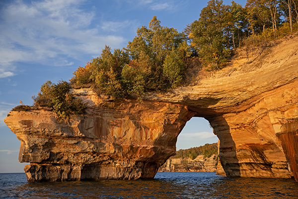 Pictured Rocks National Lakeshore in Munsing, Michican, features water that turns gold in the sunset and plunges 70 feet in front of a sheer sandstone cliff. At the base of the falls, in 20 feet of water, lies a shipwreck from 1856—the Superior.