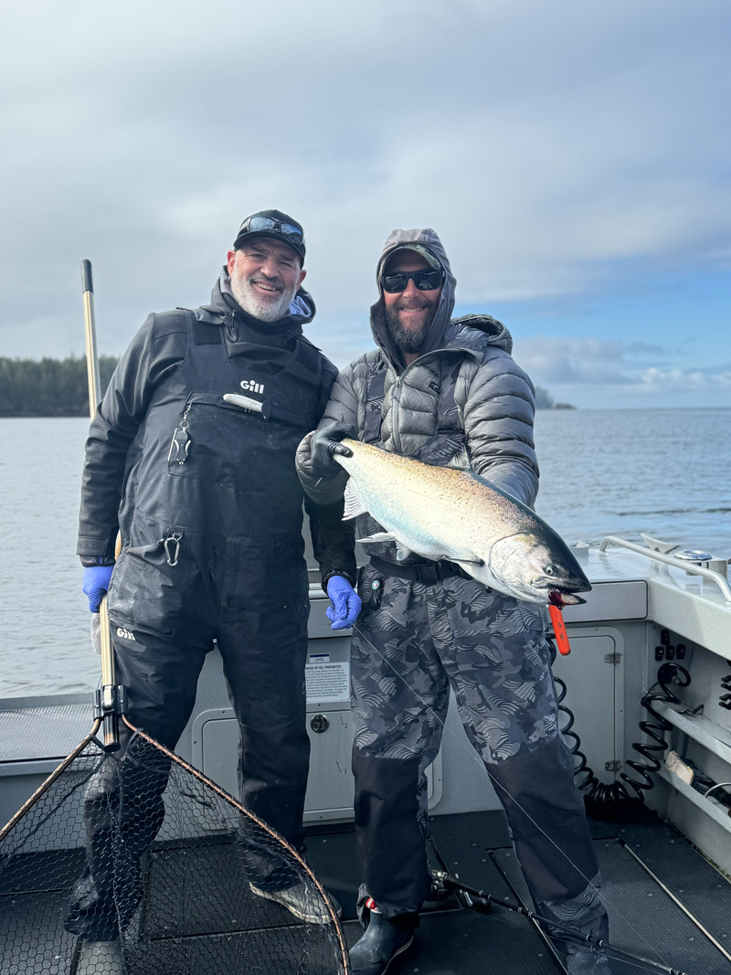 Tom Nelson and Joey Pyburn of The Outdoor Line doing what they do best, bringing bright, beautiful chinook onboard!