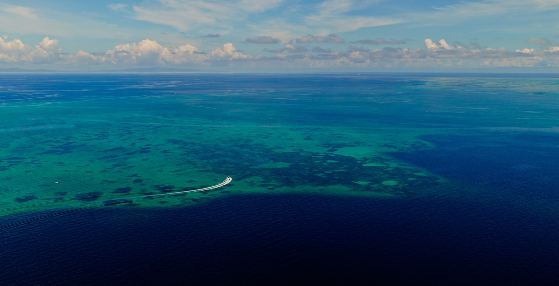 View from the air of boat driving in ocean